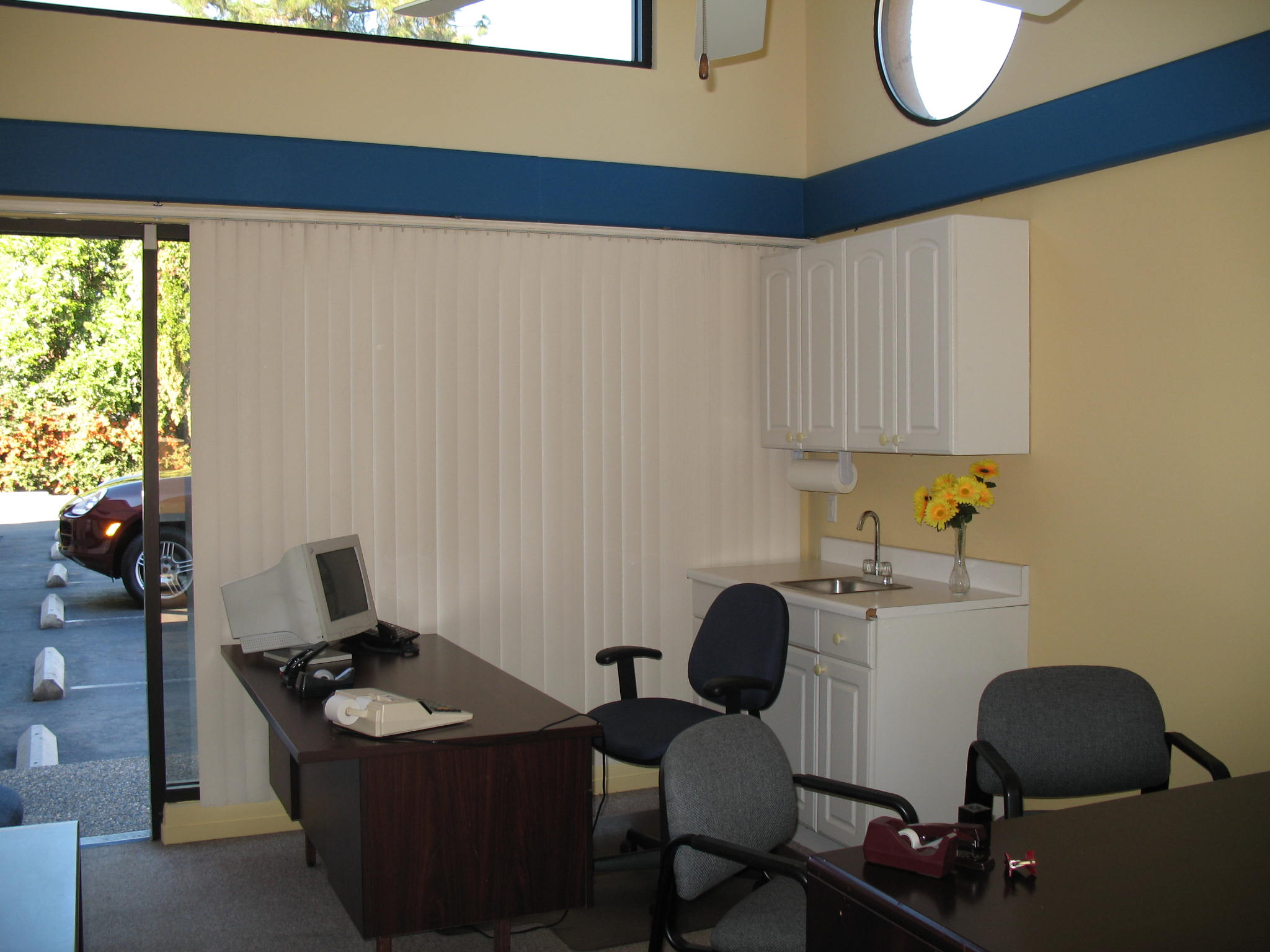 Office parking lot and desk at Fig Garden Executive Suites